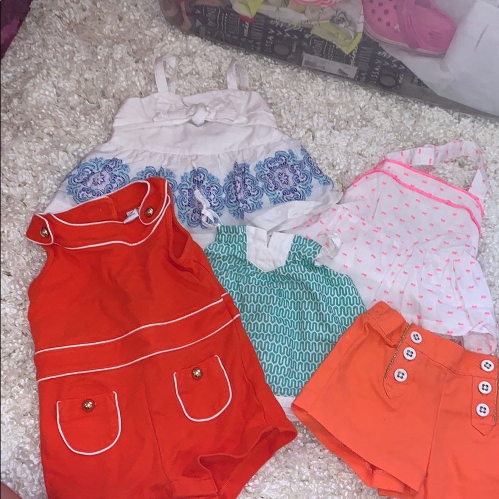 3 shirts, one romper, one short